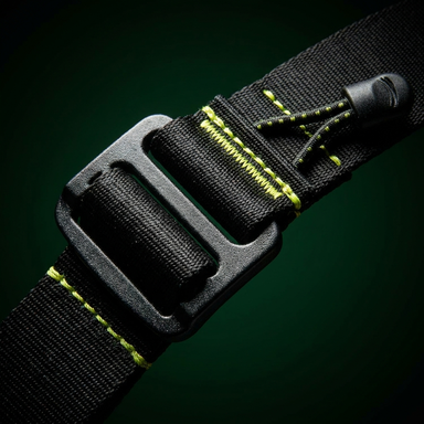 Close-up of belt buckle and cord clip